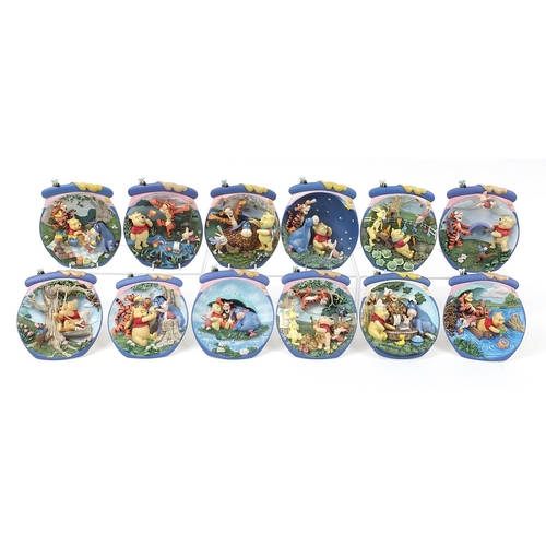 400 - Set of twelve Winnie the Pooh collector's wall plaques by The Bradford Exchange, 17cm high