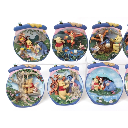 400 - Set of twelve Winnie the Pooh collector's wall plaques by The Bradford Exchange, 17cm high