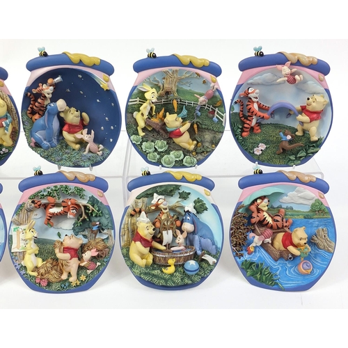 400 - Set of twelve Winnie the Pooh collector's wall plaques by The Bradford Exchange, 17cm high