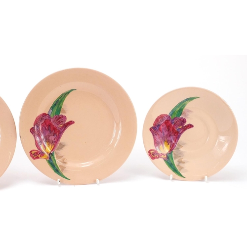 415 - Set of three Clarice Cliff Damask Rose saucers and two plates, the largest 17.5cm in diameter