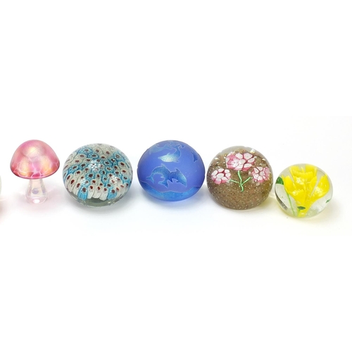 376 - Colourful glass paperweights including Caithness, the largest 8cm in diameter