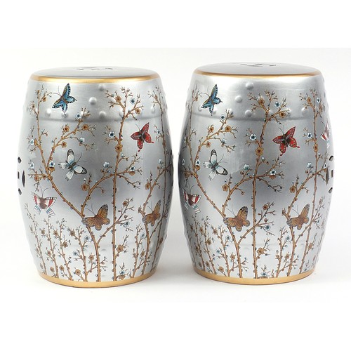 395 - Pair of Chinese porcelain barrel design garden seats hand painted with birds and insects amongst blo... 