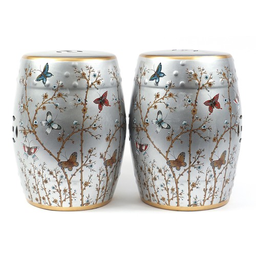 395 - Pair of Chinese porcelain barrel design garden seats hand painted with birds and insects amongst blo... 