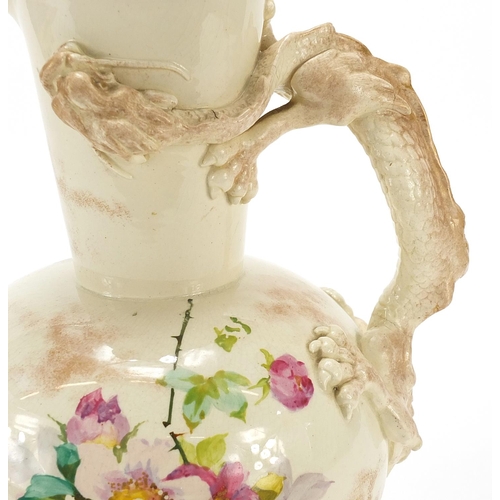 370 - Late 19th century Doulton jug with dragon handle, hand painted with flowers, 25cm high