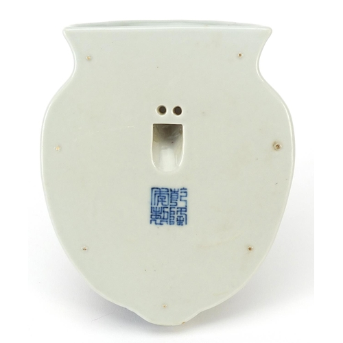 357 - Chinese blue and white with iron red porcelain wall pocket, hand painted with a bird amongst flowers... 