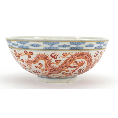 393 - Chinese blue and white with iron red porcelain bowl hand painted with dragons chasing a flaming pear... 