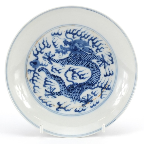 381 - Chinese blue and white porcelain dish hand painted with dragons chasing flaming pearls amongst cloud... 