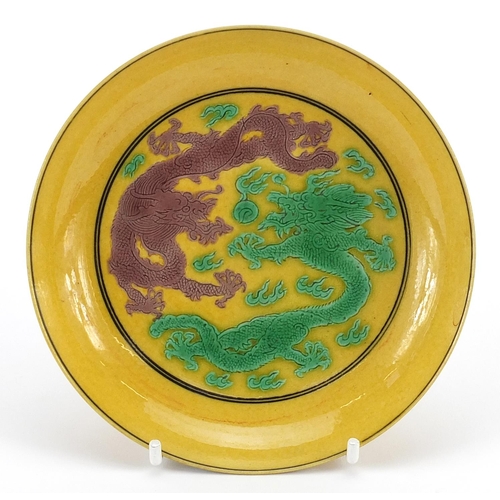 382 - Chinese yellow ground porcelain dish hand painted in green and aubergine with two dragons, six figur... 