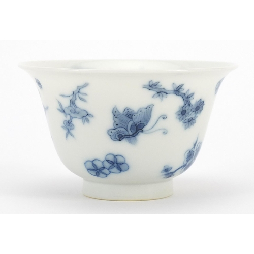 288 - Chinese blue and white porcelain tea bowl hand painted with butterflies amongst flowers, six figure ... 