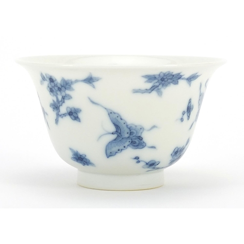 288 - Chinese blue and white porcelain tea bowl hand painted with butterflies amongst flowers, six figure ... 