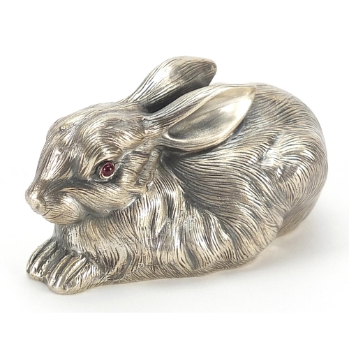 283 - Silver recumbent rabbit with ruby eyes, impressed Russian marks to the base, 6.5cm in length, 61.5g