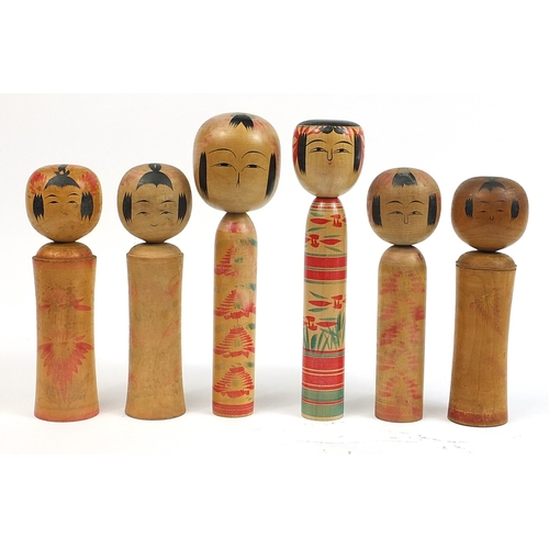 396 - Six large Japanese Kokeshi wooden dolls, the largest 37.5cm high