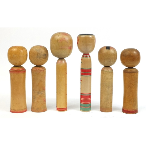 396 - Six large Japanese Kokeshi wooden dolls, the largest 37.5cm high