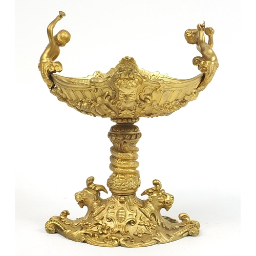 294 - Gilt bronze pedestal dish with animal heads and mermaid handles, 22cm high