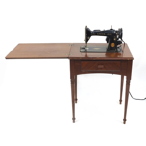 1400 - Two vintage Singer sewing machine tables, the largest 80cm high