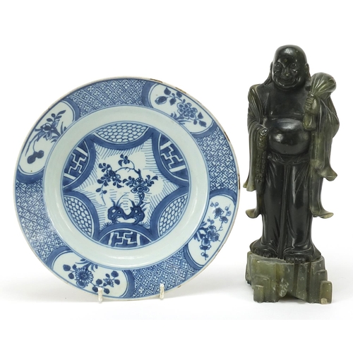 358 - Chinese green stone carving of standing Buddha and a blue and white porcelain plate hand painted wit... 