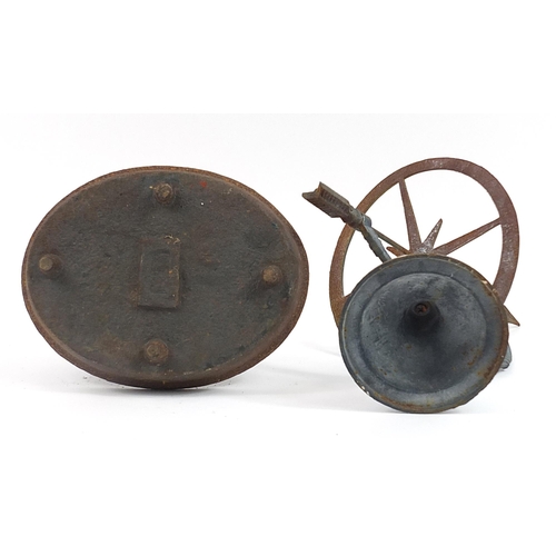 1421 - Victorian cast iron boot scraper and a painted metal sundial, the largest 35cm high