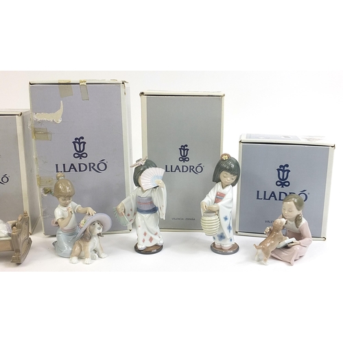 390 - Five Lladro porcelain figures and a pair of Chinese porcelain Chinaman salt and pepper casters, the ... 