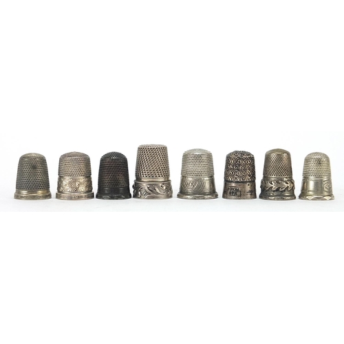 311 - Eight silver and white metal thimbles, various hallmarks, the largest 2.4cm high, 35.6g