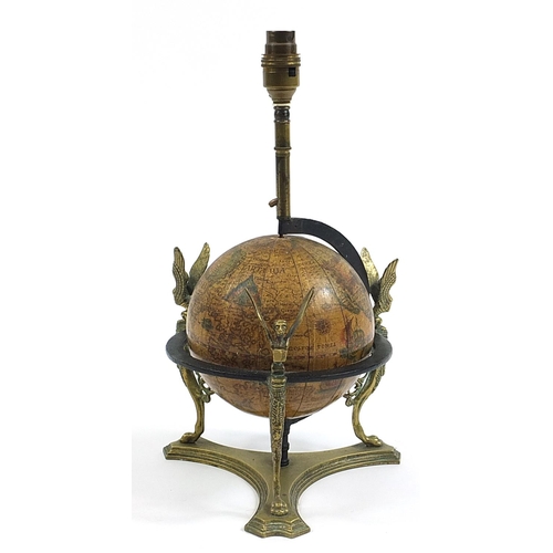 27 - Antique brass rotating globe design table lamp with griffins and paw feet, 39cm high including the f... 