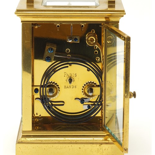 26 - French brass cased repeating carriage clock with fret panels and enamelled dial, the backplate and k... 