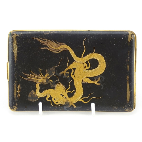 71 - Japanese damascene cigarette case by Fujii Yoshitoyo, engraved with pagodas and a dragon, 12.5cm wid... 