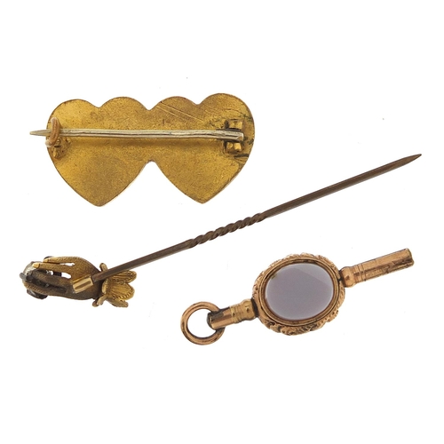 946 - Antique gold coloured metal jewellery comprising a hardstone watch key, double love heart sweetheart... 