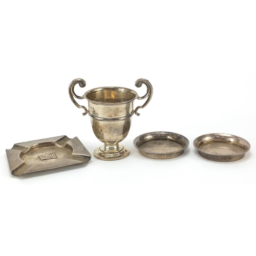 258 - Silver objects comprising twin handled trophy, pair of circular dishes and ashtray, various hallmark... 