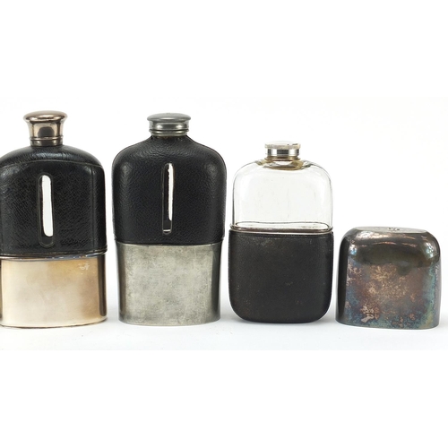 319 - Six antique and later hip flasks, five with leather mounts, the largest 18cm high