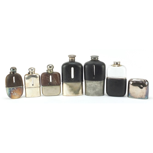 319 - Six antique and later hip flasks, five with leather mounts, the largest 18cm high