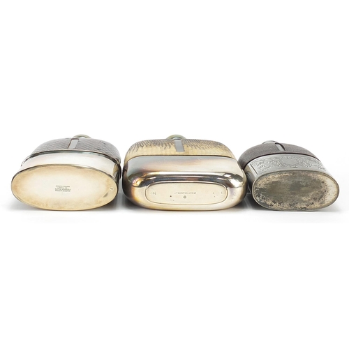 320 - Three antique glass hip flasks with silver plated, snake skin and leather mounts, the largest 18cm h... 