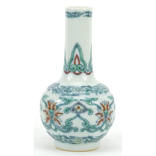 299 - Chinese doucai porcelain vase hand painted with flower heads amongst scrolling foliage, six figure c... 