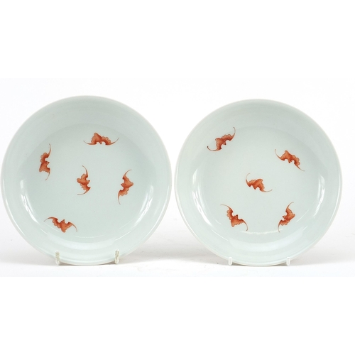 451 - Pair of Chinese porcelain shallow dishes hand painted in iron red with bats and flower heads amongst... 