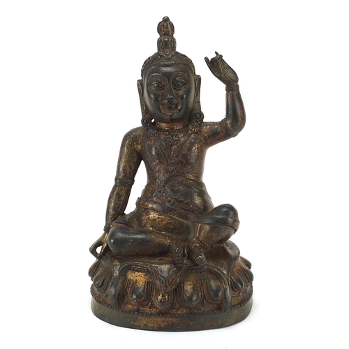 602 - Chino Tibetan patinated bronze figure of seated Buddha, 23cm high