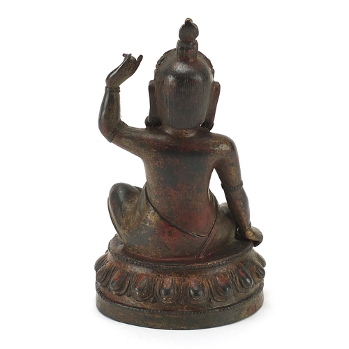 602 - Chino Tibetan patinated bronze figure of seated Buddha, 23cm high