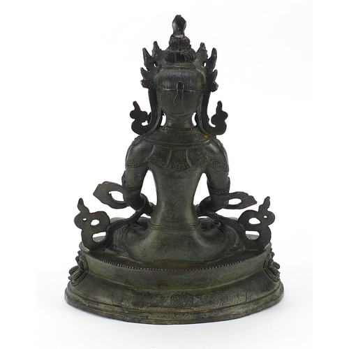 530 - Chino Tibetan patinated bronze figure of seated Buddha, 29.5cm high