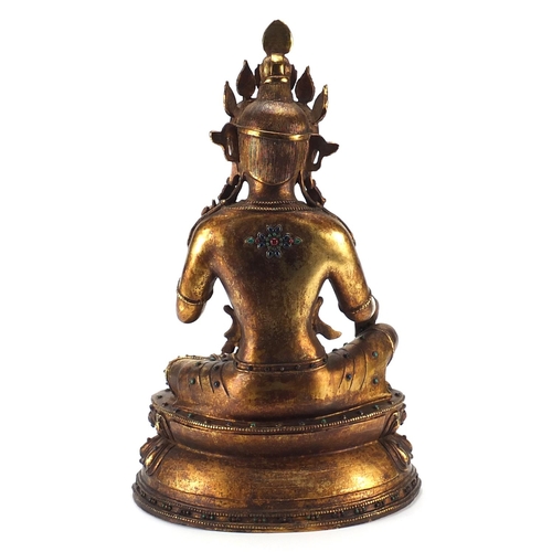 488 - Large Chino Tibetan gilt bronze and jewelled figure of seated Buddha, 50cm high