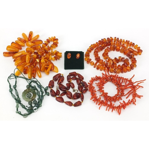 936 - Assorted jewellery comprising three natural and Baltic amber necklaces, pair of silver and amber ear... 