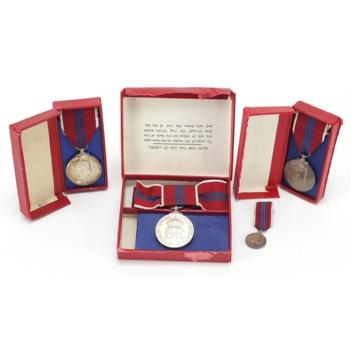 466 - Three Elizabeth II 1953 Coronation medals and a miniature with boxes including a ladies issue