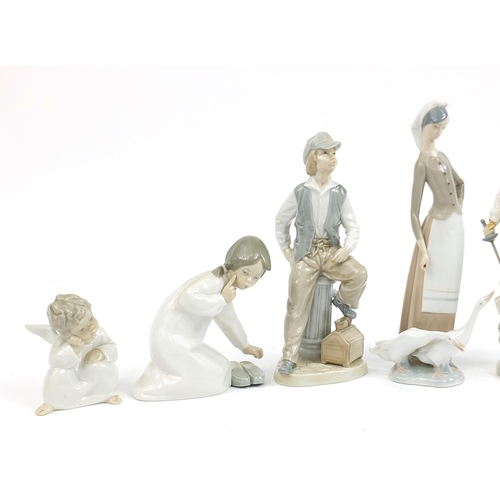 587 - Lladro and Nao porcelain figures including Don Quixote, the largest 29cm high