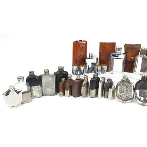 321 - Large collection of antique and later hip flasks, the largest 20.5cm high