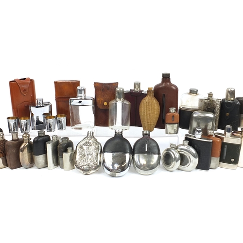 321 - Large collection of antique and later hip flasks, the largest 20.5cm high