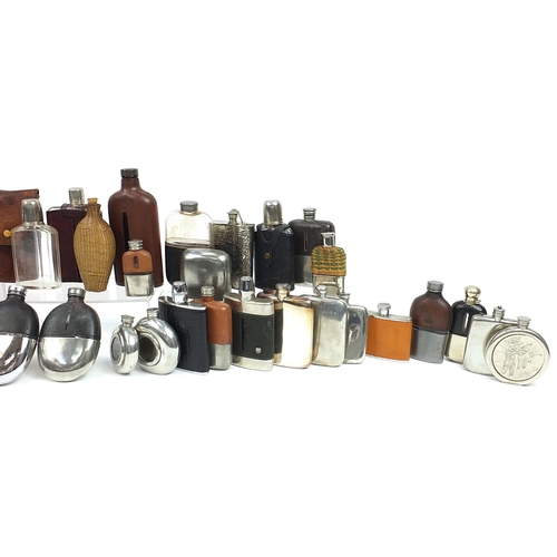 321 - Large collection of antique and later hip flasks, the largest 20.5cm high