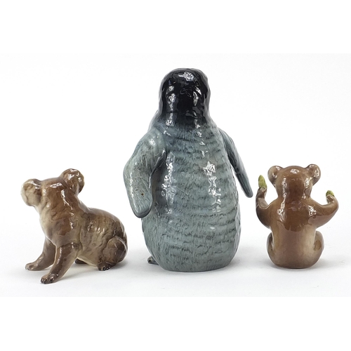 396 - Beswick animals comprising baby Emperor penguin and two koalas, the largest 17cm high