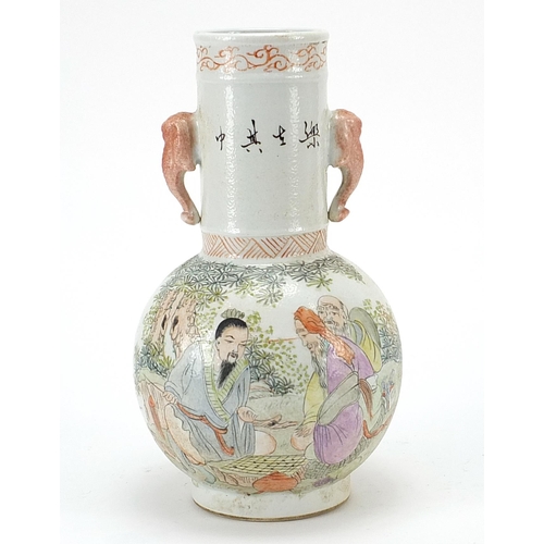 402 - Chinese porcelain vase with elephant head handles hand painted in the famille rose palette with figu... 