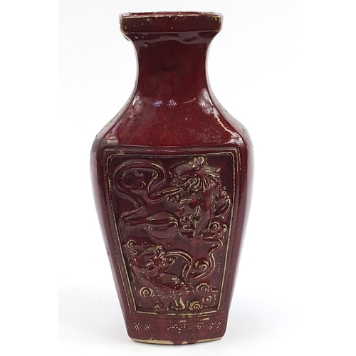 558 - Large Chinese porcelain vase having a sang de boeuf glaze, decorated in relief with dragon, phoenix ... 