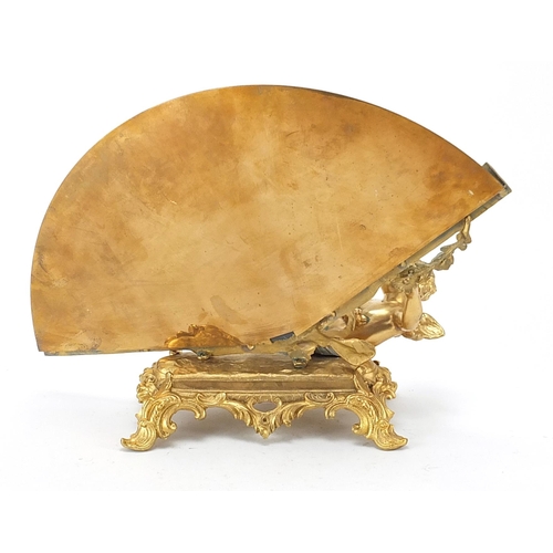 276 - French Empire style gilt bronze table mirror with Putti, 36cm wide