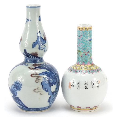 564 - Two Chinese porcelain vases comprising a blue and white with iron red double gourd example and one h... 