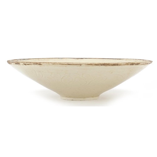 598 - Chinese porcelain bowl incised with a child amongst flowers, 23cm in diameter