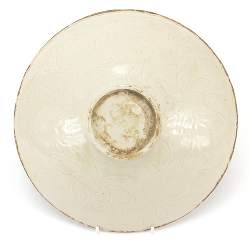 598 - Chinese porcelain bowl incised with a child amongst flowers, 23cm in diameter